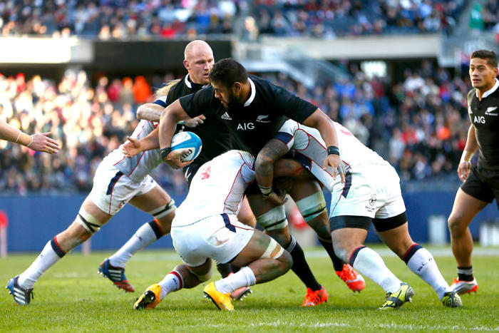 American players display fine rugby tackling form against New Zealand’s Patrick Tuipulotu. (Phil Walter/Getty Images)
